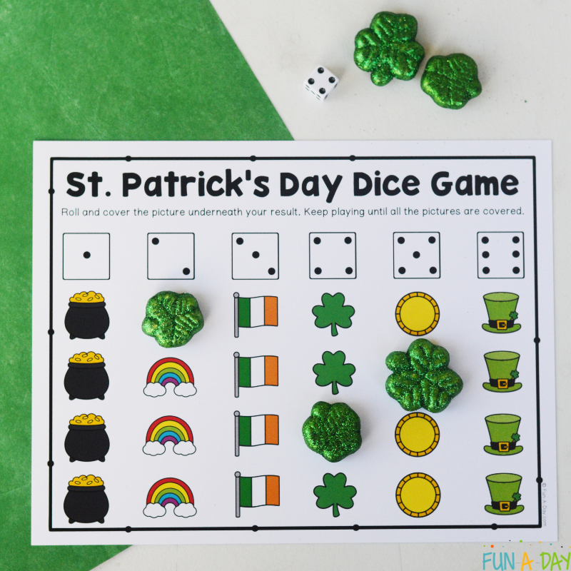 st. patrick's day math game printable with a die and shamrock manipulatives
