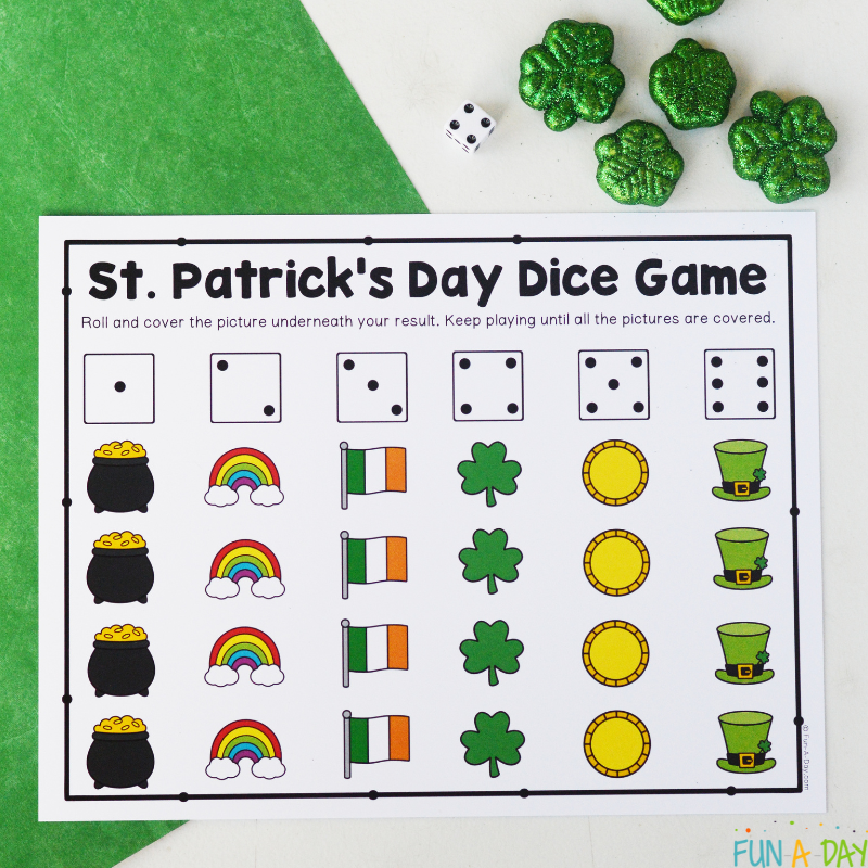 st. patrick's day dice game printable ready to be used, alongside die and shamrock manipulatives
