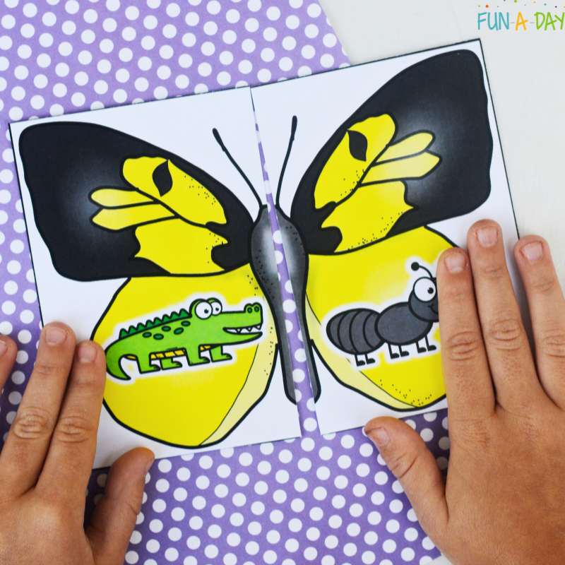 Matching alligator and ant on butterfly-themed beginning sounds puzzle