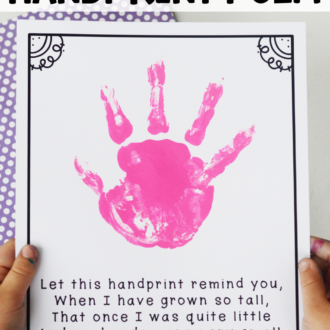 child holding a completed poem page with text that reads Mother's Day handprint poem