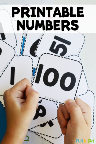 child holding number 100 over pile of number cards with text that reads printable numbers