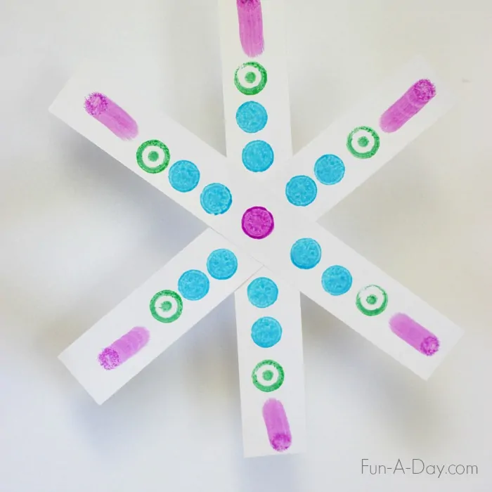 Colorful symmetry snowflake craft.jpg